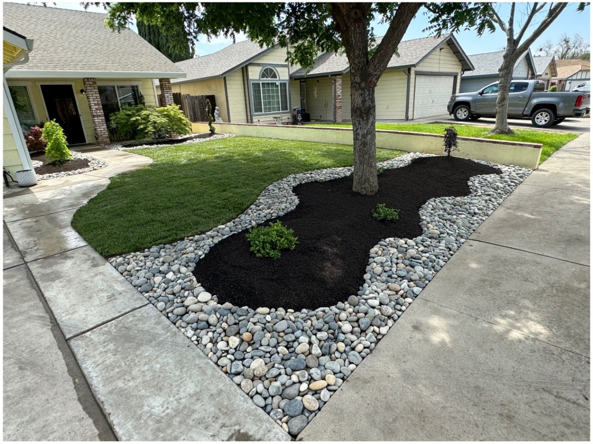 Curved lawn & river rock installation — after